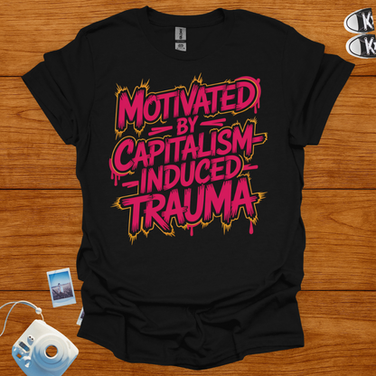 Black t-shirt with pink and yellow text on a wooden surface